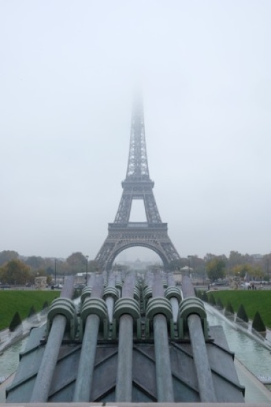 A different perspective of the iconic Eiffel Tower from Place de Trocadéro on a foggy day.