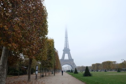A snapshot of the Eiffel Tower from Champ de Mars in full fall color.